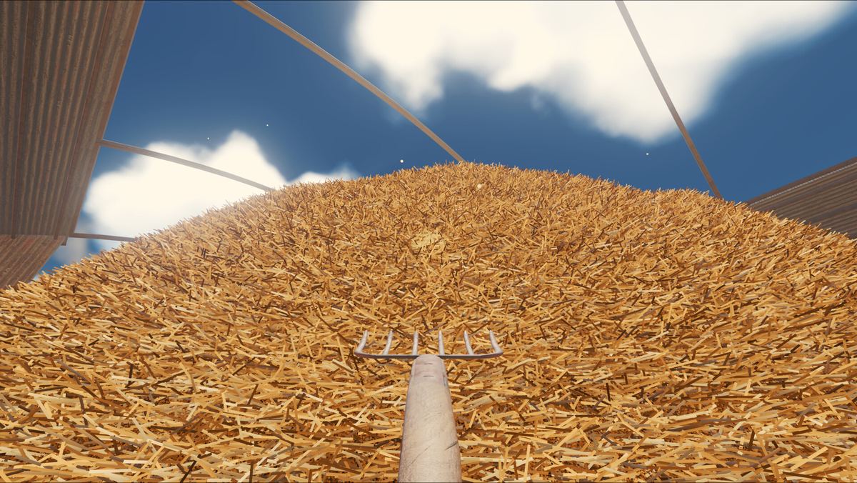 Standing on top of the pile with a pitchfork